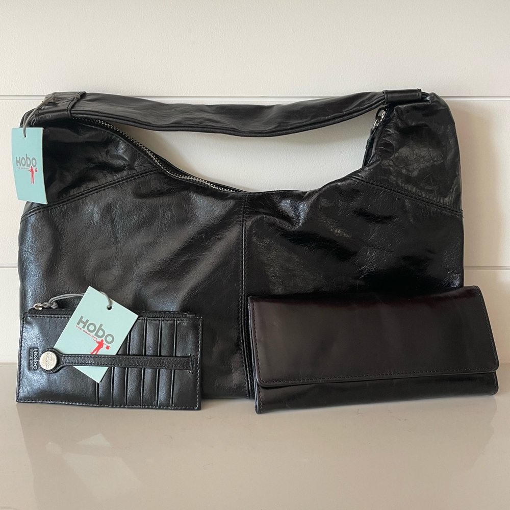 HOBO black  leather bag, tri-fold wallet, and card carrier. NEVER USED. NWT.